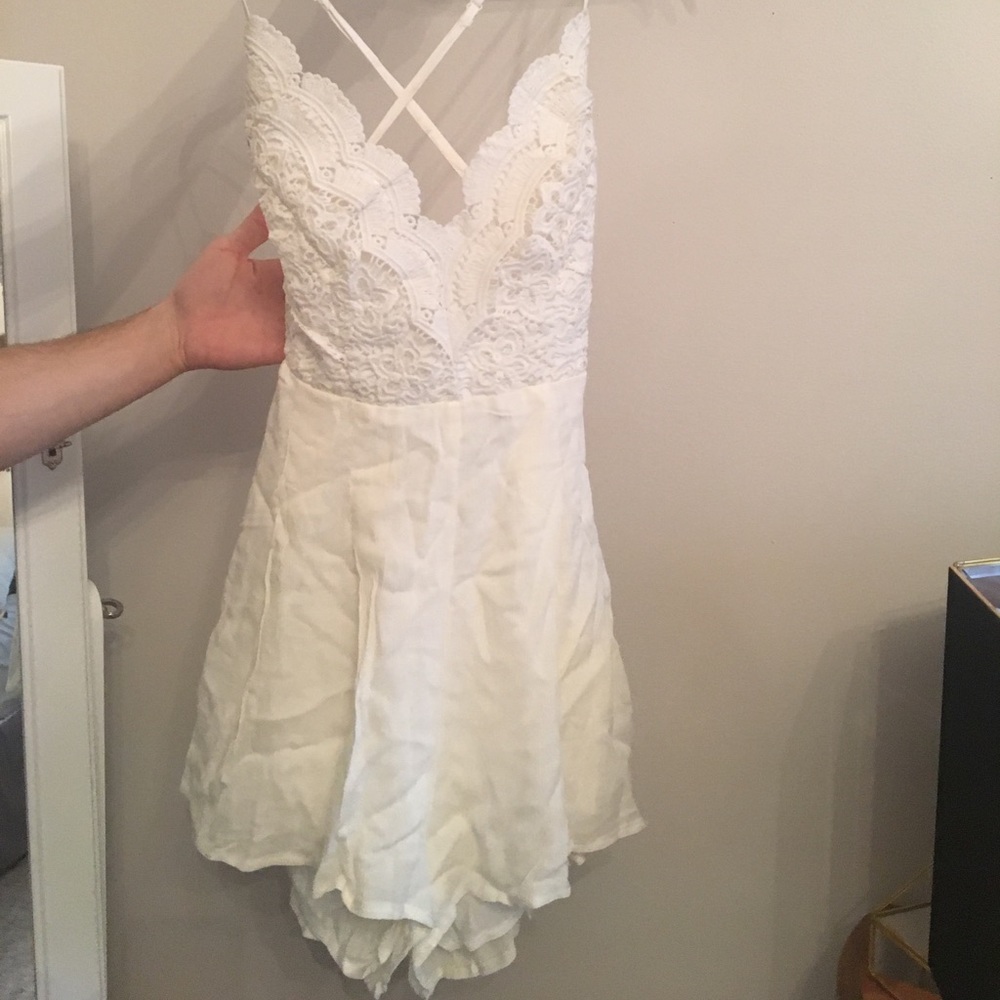 Lulu’s ivory backless lace romper